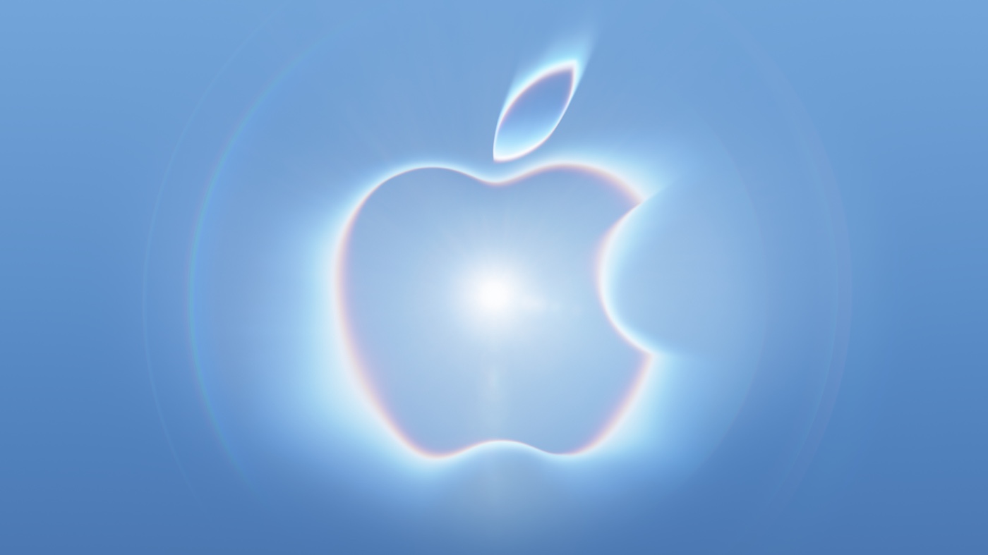 푸른 빛과 렌즈 플레어로 빛나는 Apple 로고